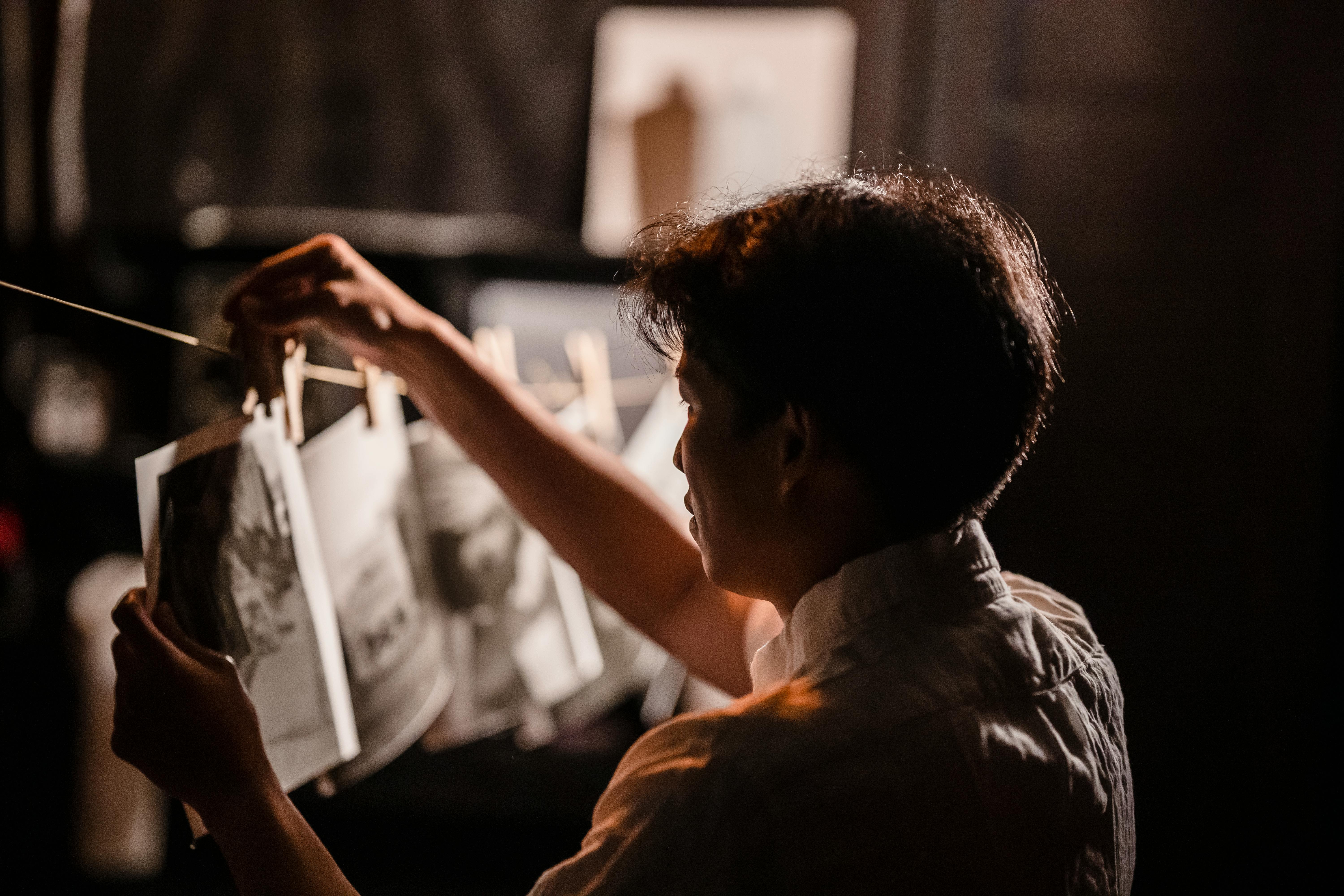 Photographer in darkroom